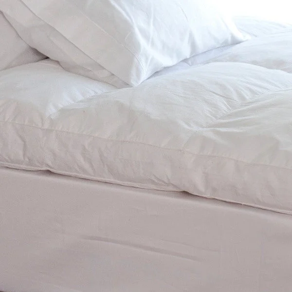 Oversized duvet covers that drape beautifully over the sides of the bed for a luxurious lookDaundekken Featherbed