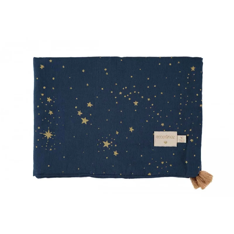 Cotton blankets for breathability and a lightweight feelnobodinoz Treasure Summer Blanket Gold Stella/Night Blue